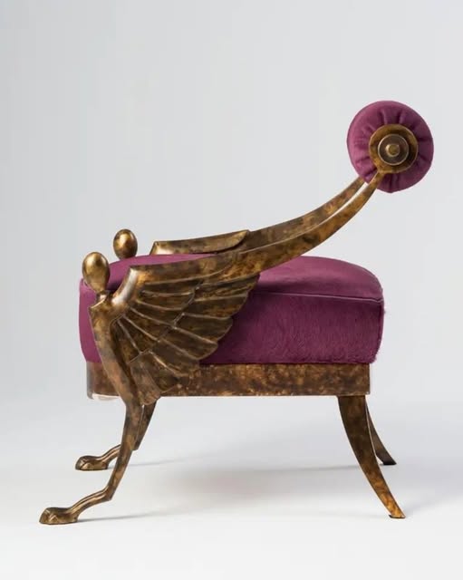 A gilded winged armchair in plum velvet, from TG Living's Instagram